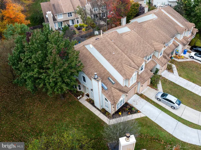 an aerial view of a house with a yard basket ball court and outdoor seating