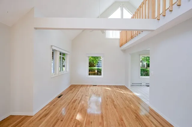 a view of room with window and hardwood floor