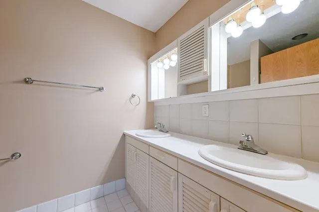 a bathroom with a sink and vanity
