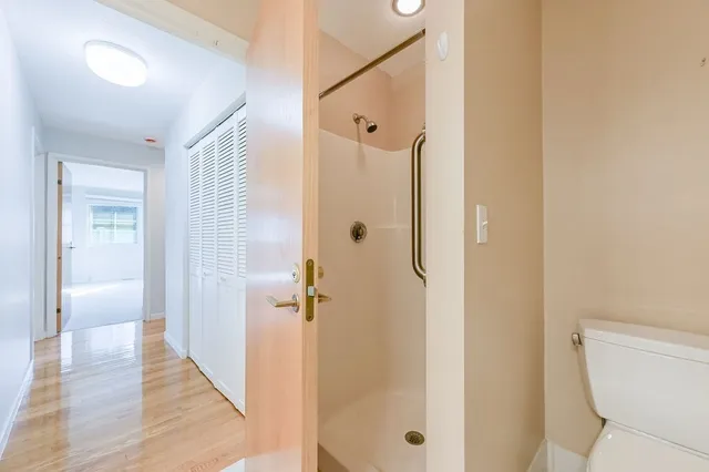 a bathroom with a shower and toilet