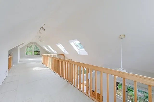 a view of a hallway with windows