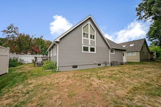 a view of deck with table and chairs with wooden floor and plants