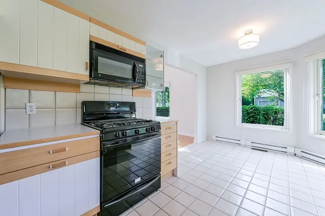 a kitchen with a stove and a microwave
