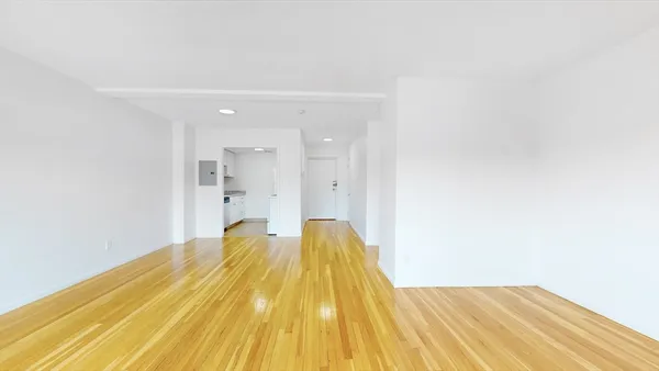 a spacious bedroom with a bed and a table