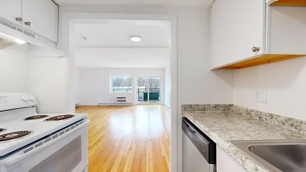 a kitchen with a stove and a sink