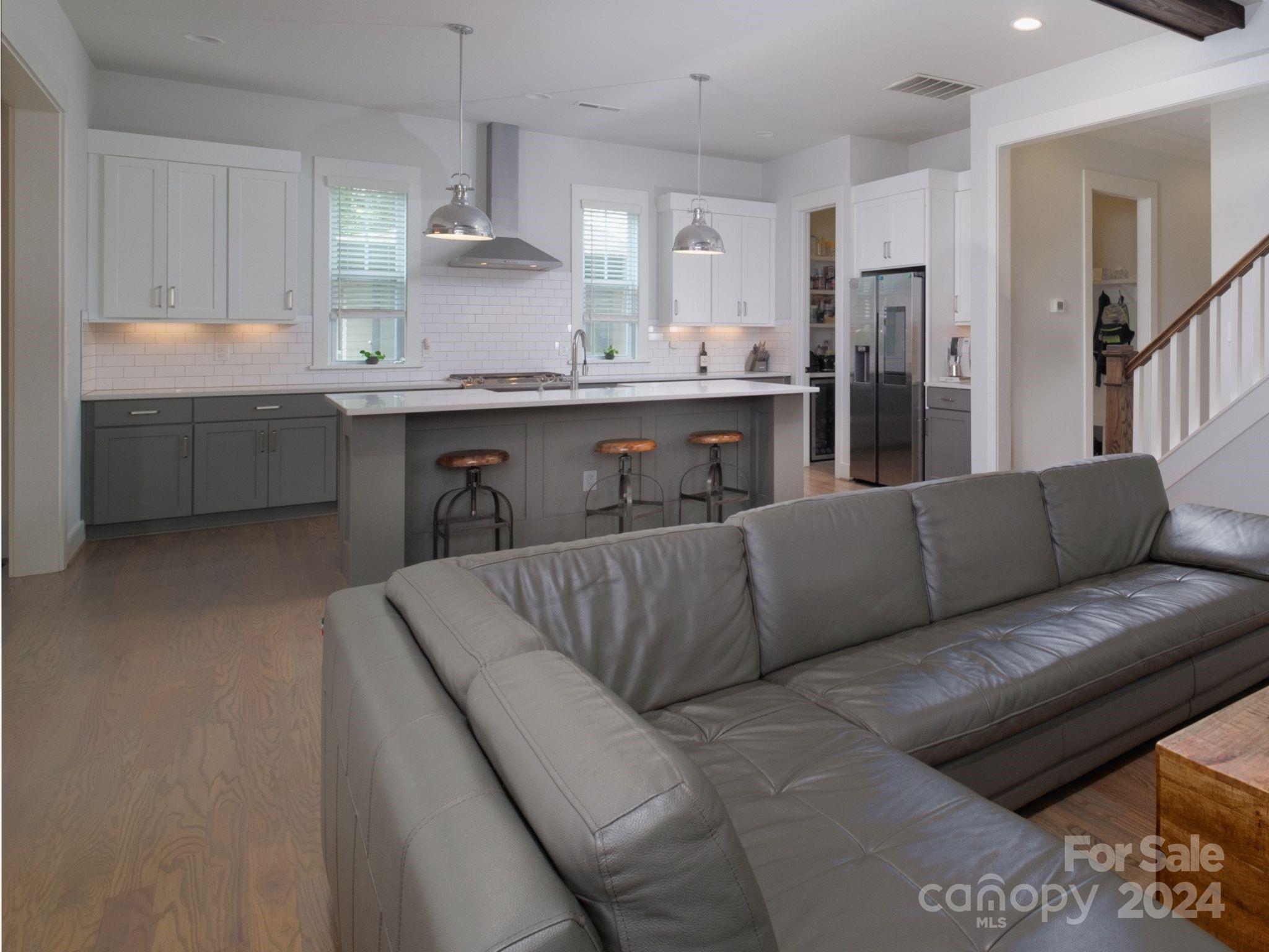 1410 Briar Creek Road Charlotte, NC 28205 - Photo 13 of 42 a living room with furniture and kitchen view