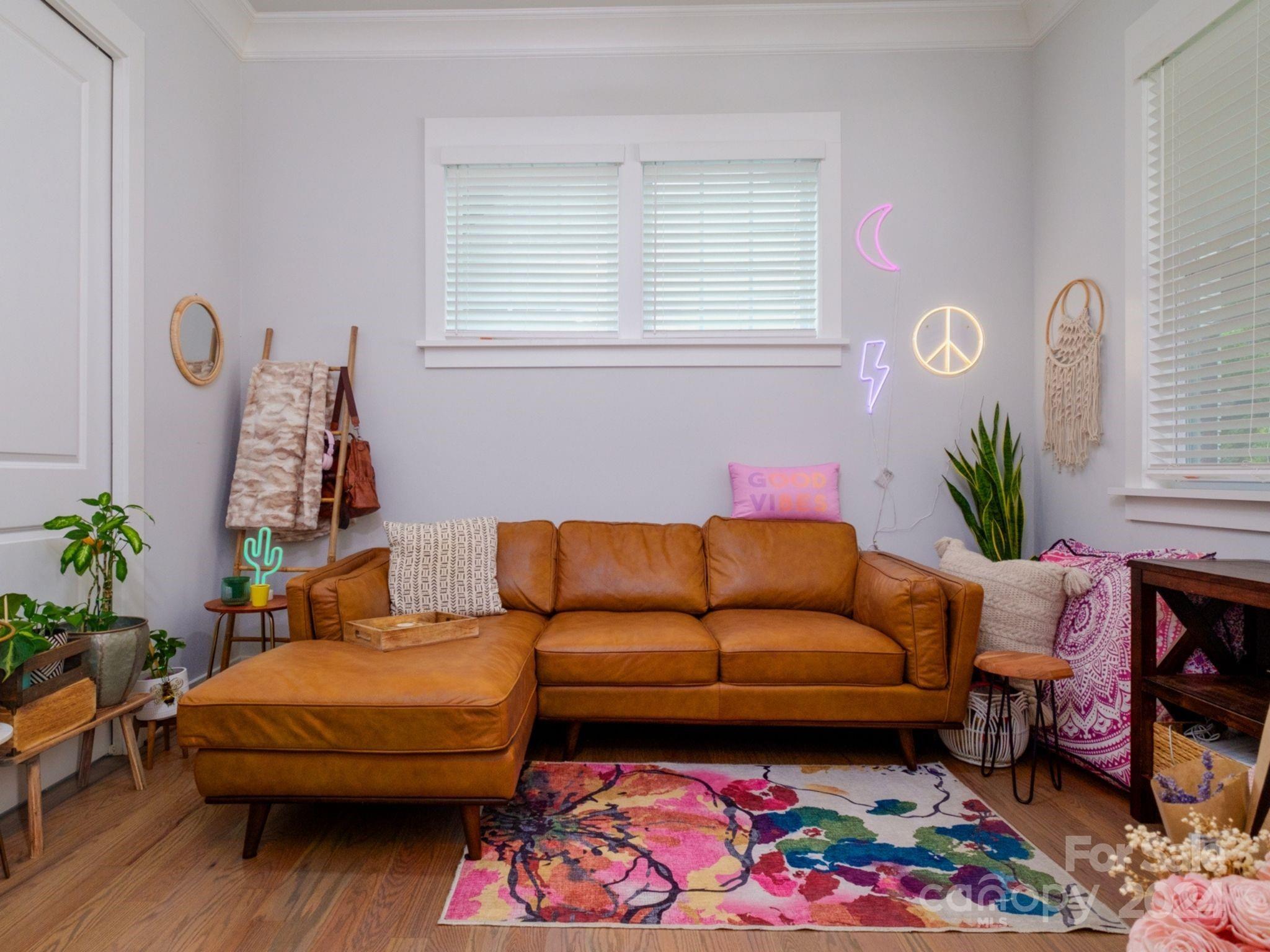 1410 Briar Creek Road Charlotte, NC 28205 - Photo 19 of 42 a living room with furniture and a potted plant