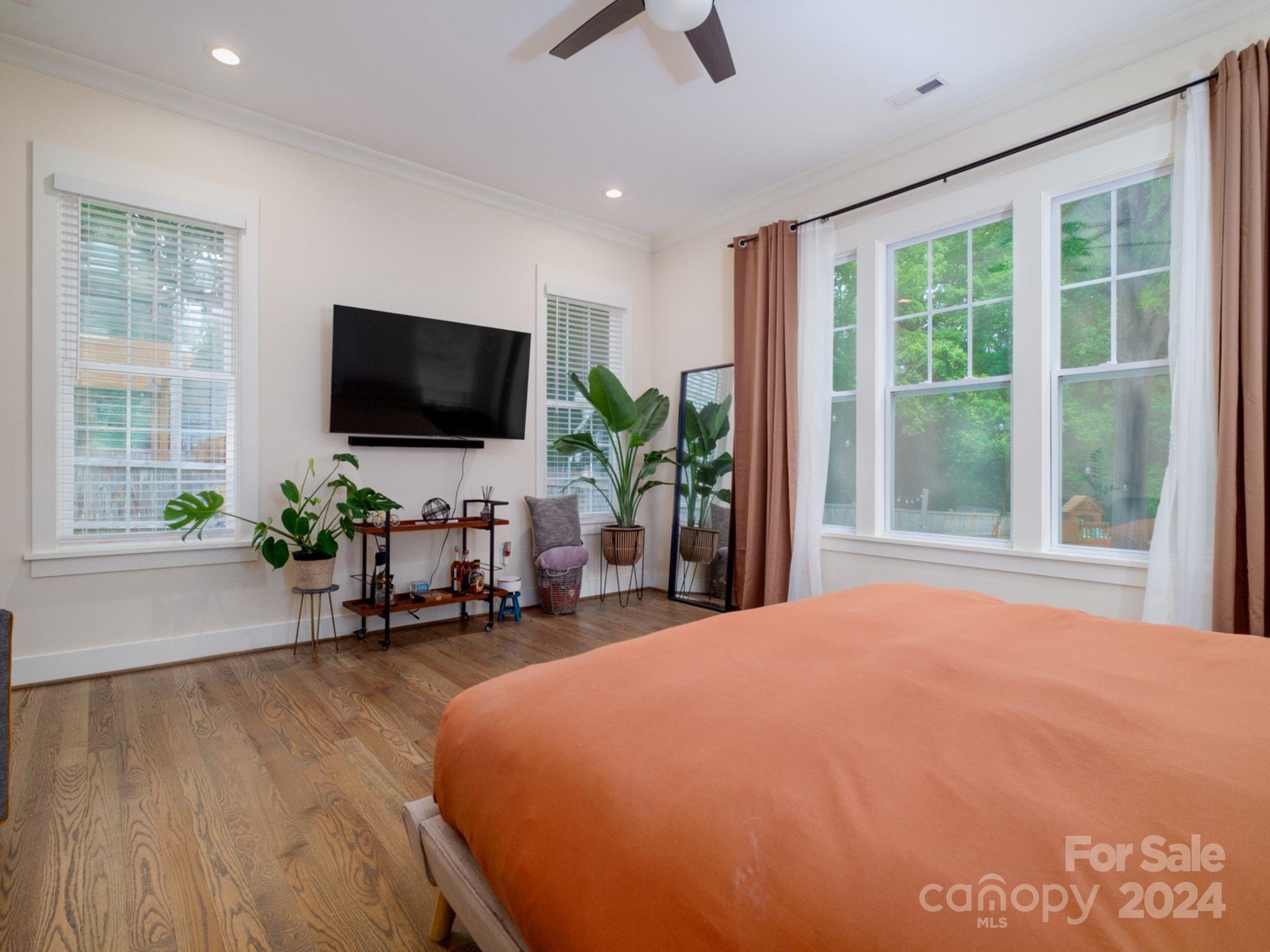 1410 Briar Creek Road Charlotte, NC 28205 - Photo 25 of 42 a living room with furniture and a flat screen tv