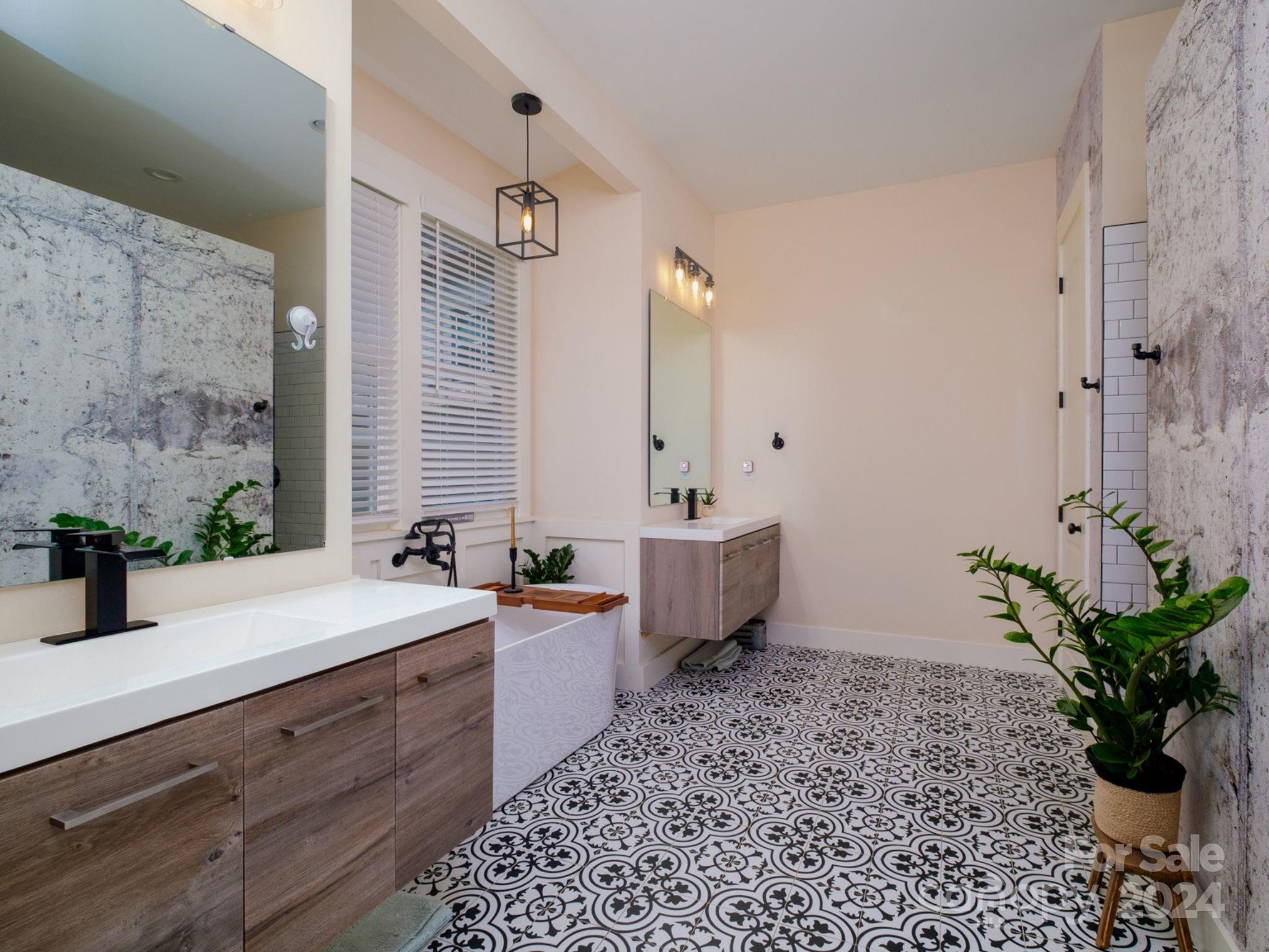 1410 Briar Creek Road Charlotte, NC 28205 - Photo 27 of 42 a spacious bathroom with a bathtub sink and toilet