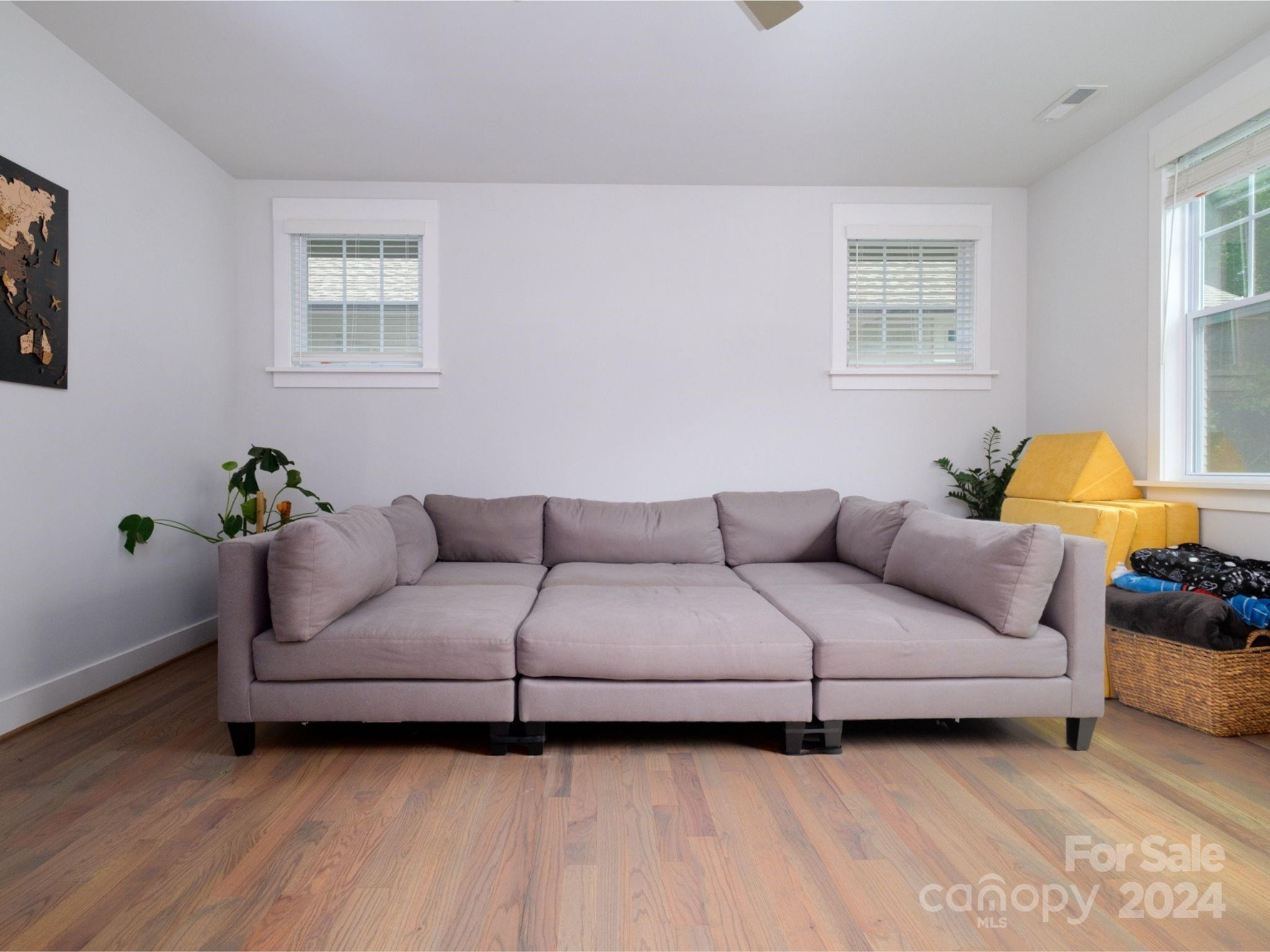 1410 Briar Creek Road Charlotte, NC 28205 - Photo 33 of 42 a living room with a couch and a window