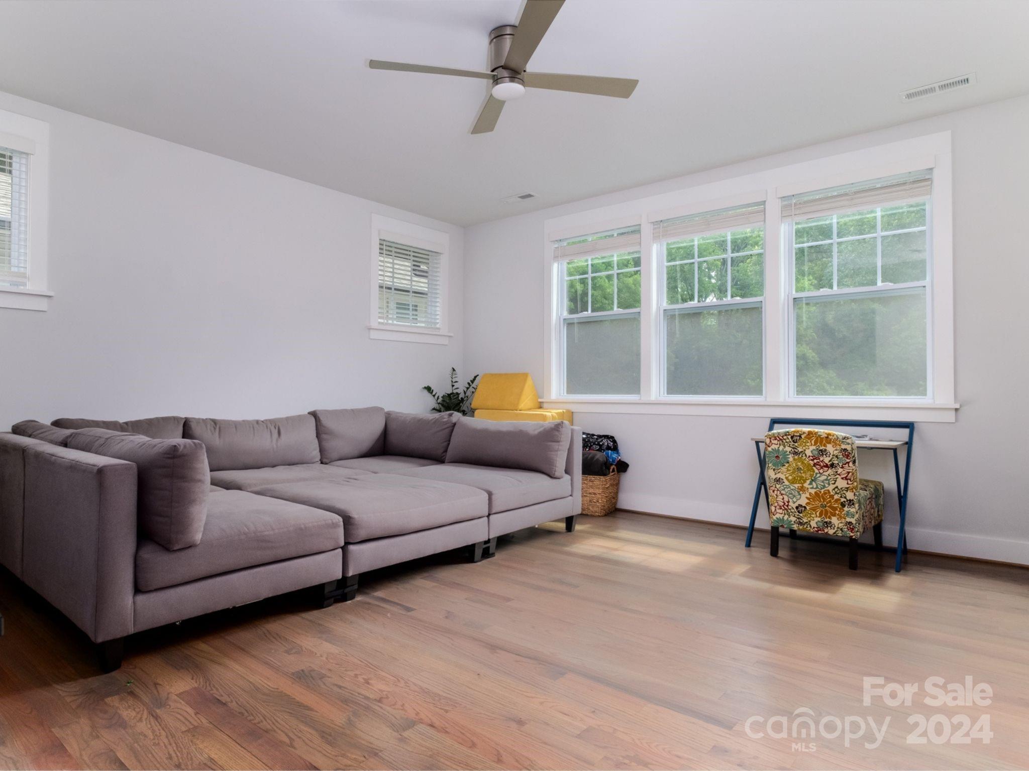 1410 Briar Creek Road Charlotte, NC 28205 - Photo 34 of 42 a living room with furniture and a window