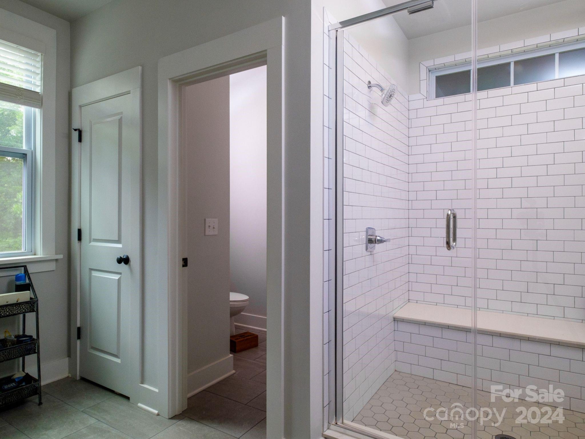 1410 Briar Creek Road Charlotte, NC 28205 - Photo 36 of 42 a bathroom with a shower