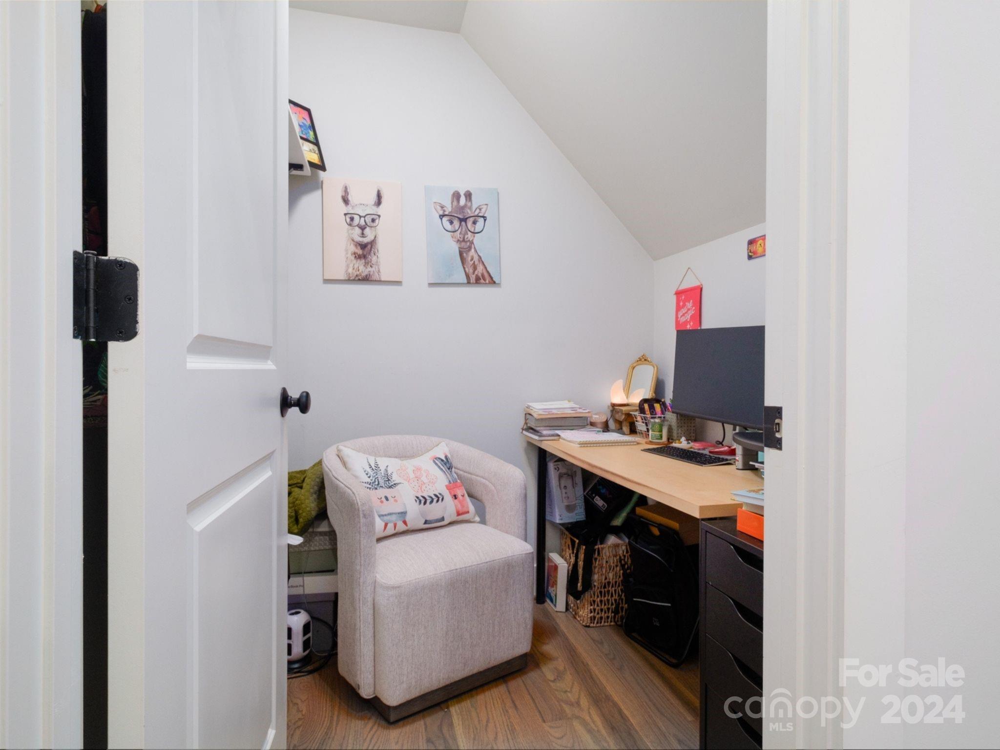 1410 Briar Creek Road Charlotte, NC 28205 - Photo 39 of 42 a view of a workspace with furniture and a window