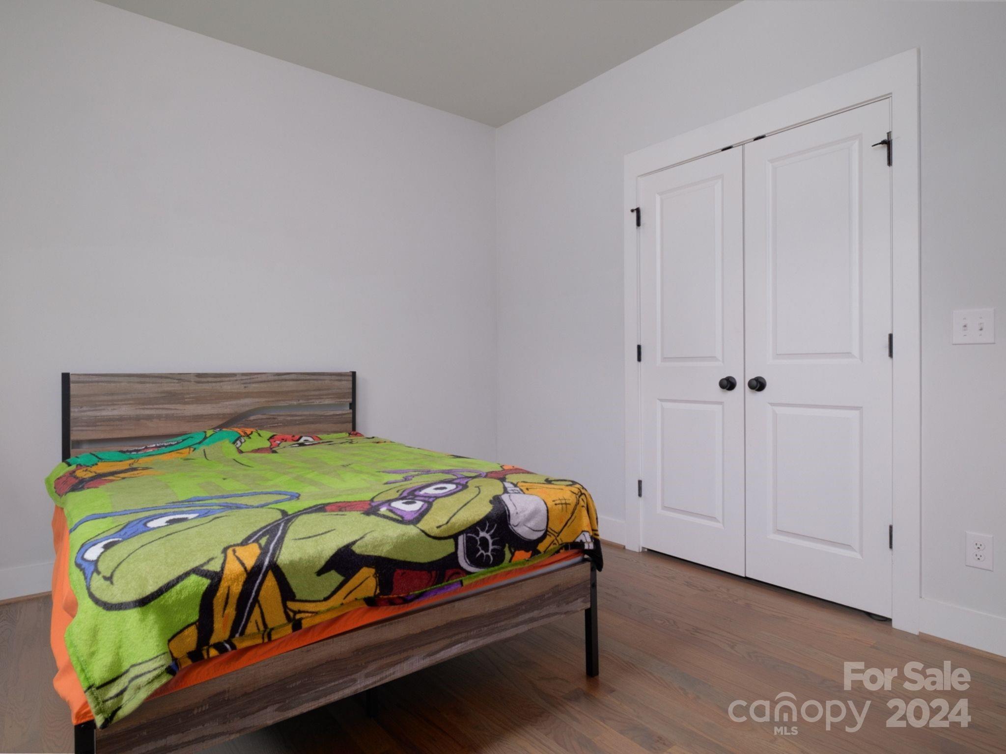 1410 Briar Creek Road Charlotte, NC 28205 - Photo 41 of 42 a bedroom with a bed and a two dresser