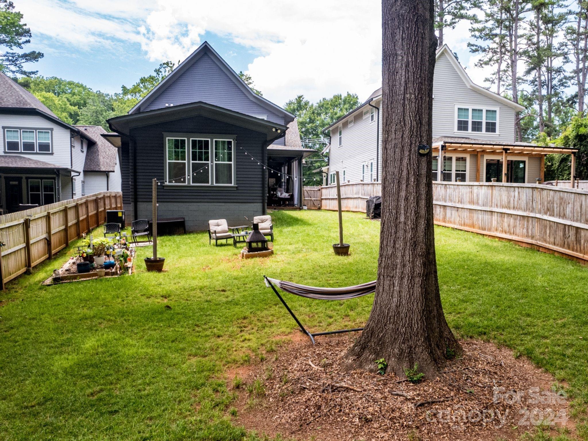 1410 Briar Creek Road Charlotte, NC 28205 - Photo 6 of 42 a view of a house with a yard patio and a slide