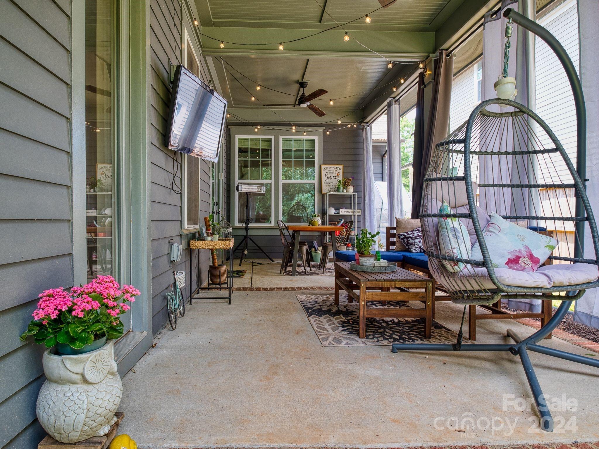 1410 Briar Creek Road Charlotte, NC 28205 - Photo 7 of 42 a view of a chairs and table in the patio