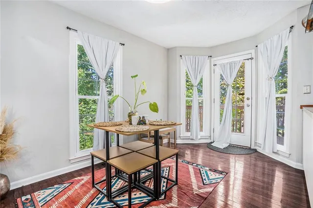 a view of a livingroom with furniture and wooden floor