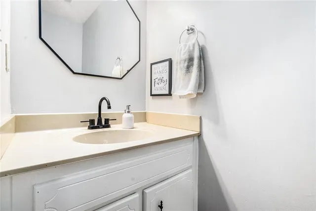 a bathroom with a sink and mirror