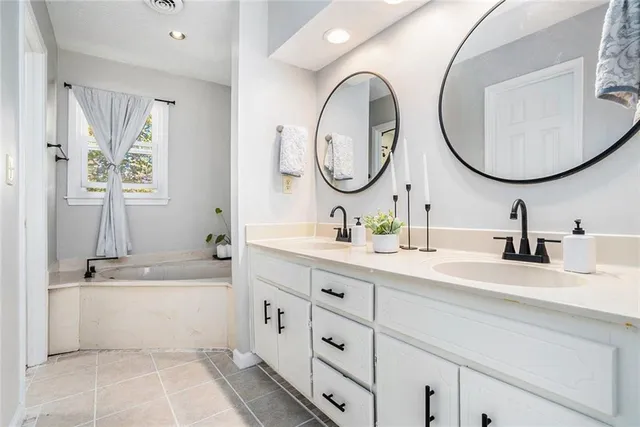 a bathroom with a sink double vanity and a mirror