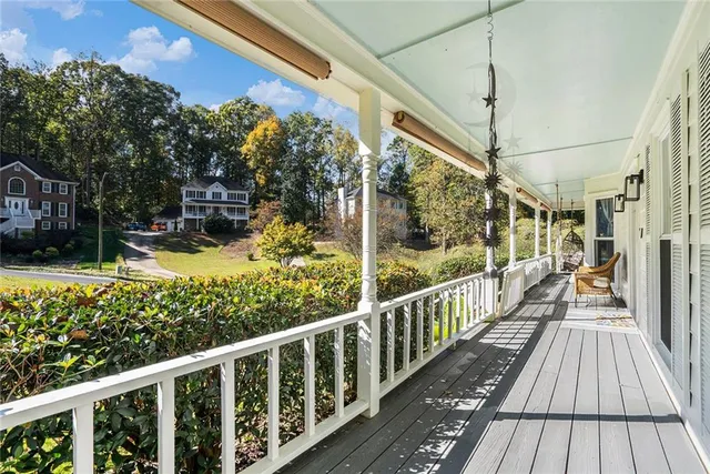 a view of a balcony with wooden floor
