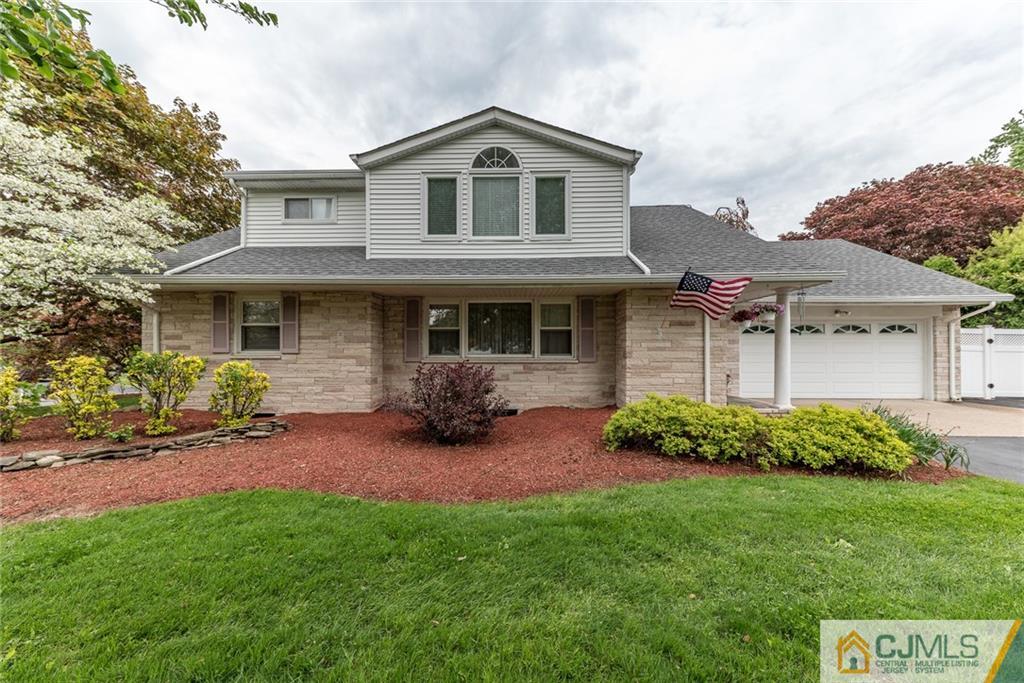144 Upper Ferry Road Ewing, NJ 08628 - Photo 1 of 25 a front view of a house with a garden and yard