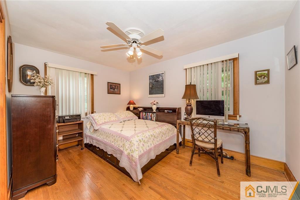 144 Upper Ferry Road Ewing, NJ 08628 - Photo 11 of 25 a spacious bedroom with a bed and a desk