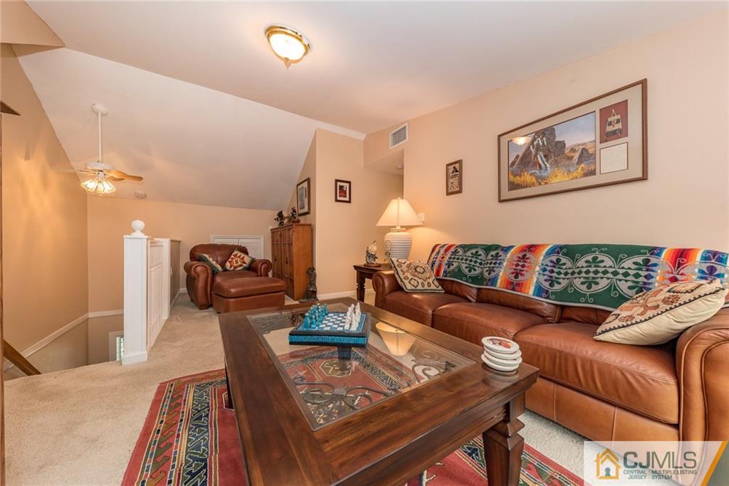 144 Upper Ferry Road Ewing, NJ 08628 - Photo 14 of 25 a living room with furniture and wooden floor