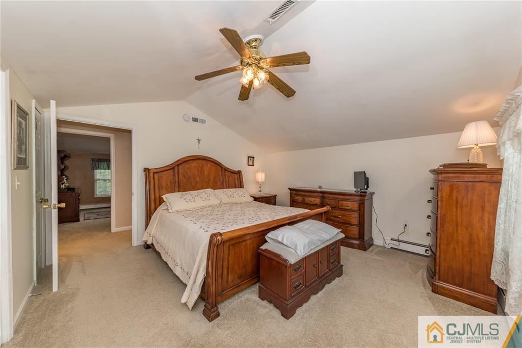 144 Upper Ferry Road Ewing, NJ 08628 - Photo 16 of 25 a bedroom with a bed and window