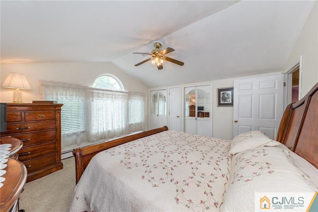 144 Upper Ferry Road Ewing, NJ 08628 - Photo 17 of 25 a bedroom with a bed and wooden floor
