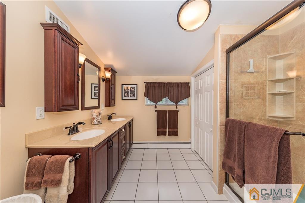 144 Upper Ferry Road Ewing, NJ 08628 - Photo 18 of 25 a bathroom with a sink and a mirror