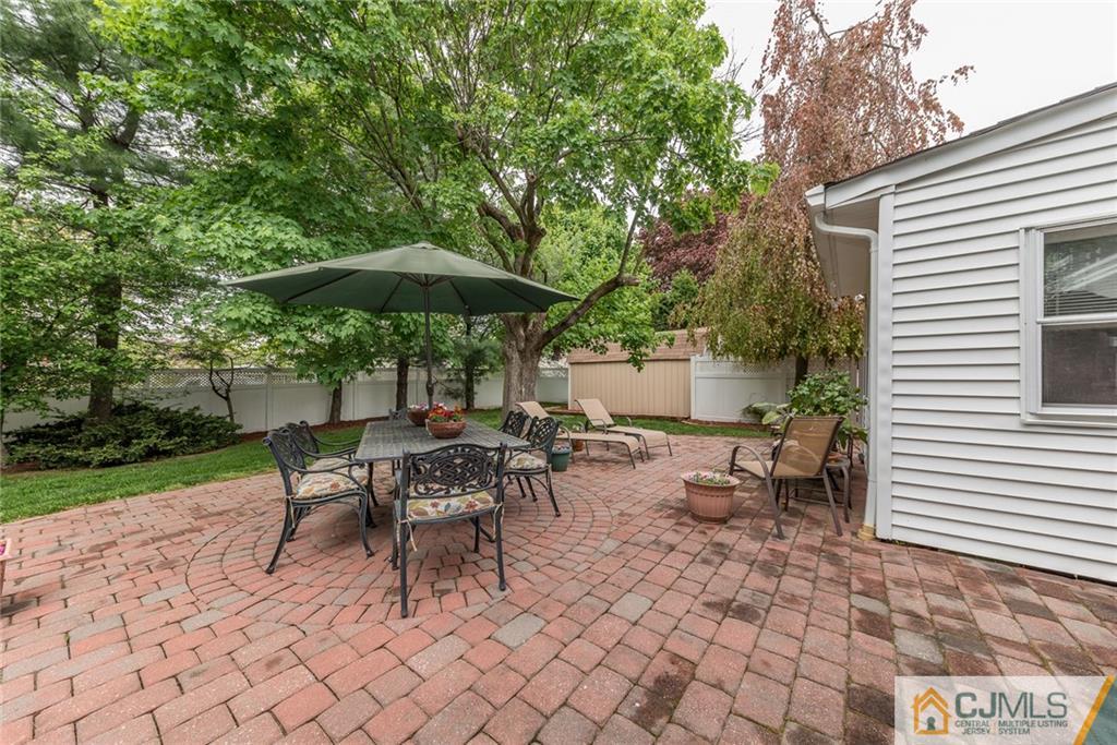 144 Upper Ferry Road Ewing, NJ 08628 - Photo 23 of 25 a view of a tables and chairs under an umbrella