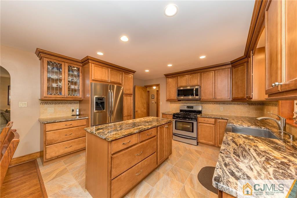 144 Upper Ferry Road Ewing, NJ 08628 - Photo 4 of 25 a kitchen with stainless steel appliances granite countertop a stove a sink and a refrigerator