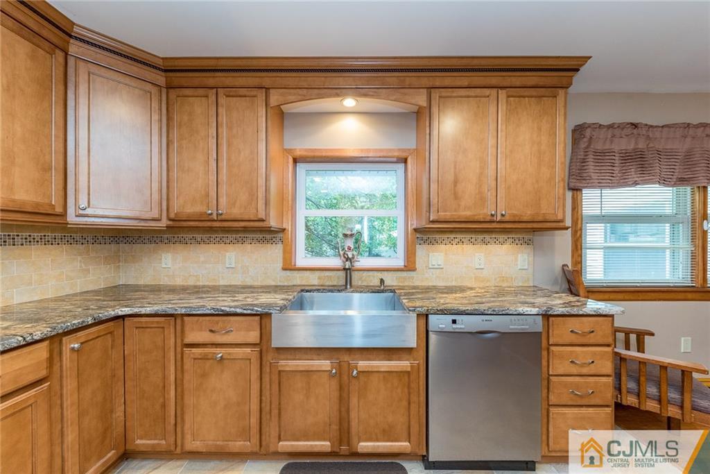 144 Upper Ferry Road Ewing, NJ 08628 - Photo 5 of 25 a kitchen with granite countertop cabinets stainless steel appliances and a sink