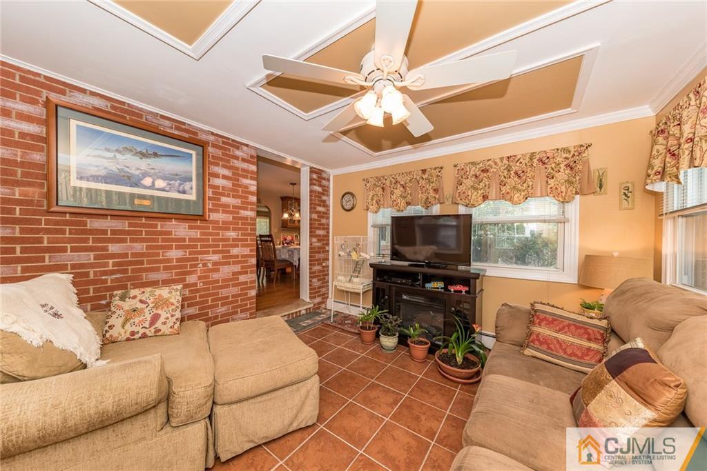 144 Upper Ferry Road Ewing, NJ 08628 - Photo 10 of 25 a living room with furniture and a flat screen tv