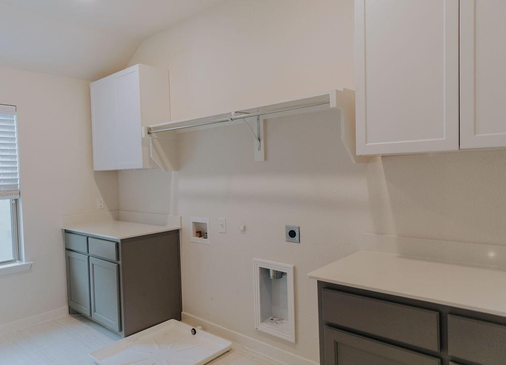 989 Sprangletop Street Allen, TX 75013 - Photo 14 of 20 a view of cabinets and wooden floor
