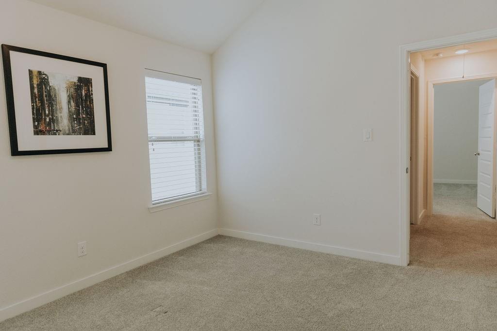 989 Sprangletop Street Allen, TX 75013 - Photo 17 of 20 an empty room with windows and closet