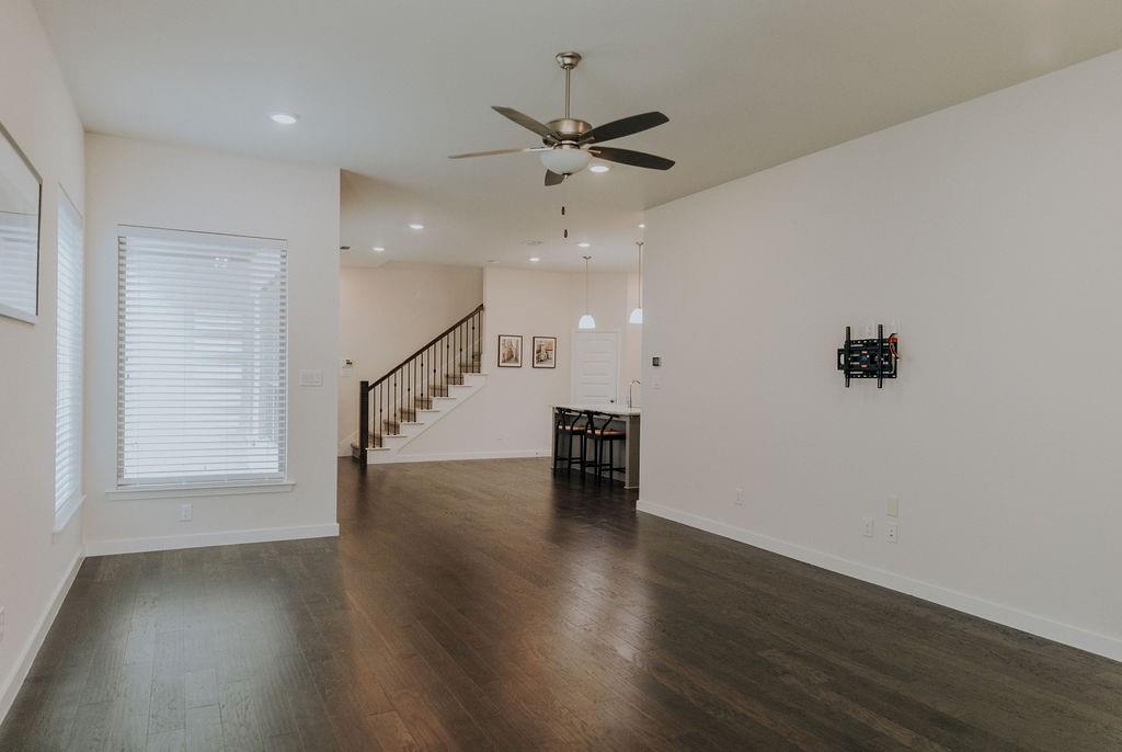989 Sprangletop Street Allen, TX 75013 - Photo 2 of 20 wooden floor in an empty room with a window