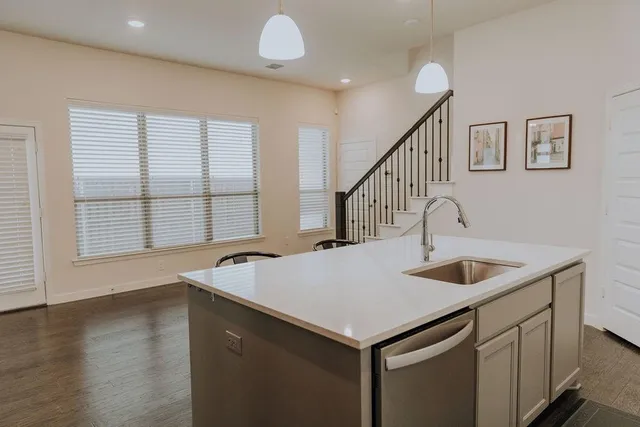 a kitchen with a sink and a window