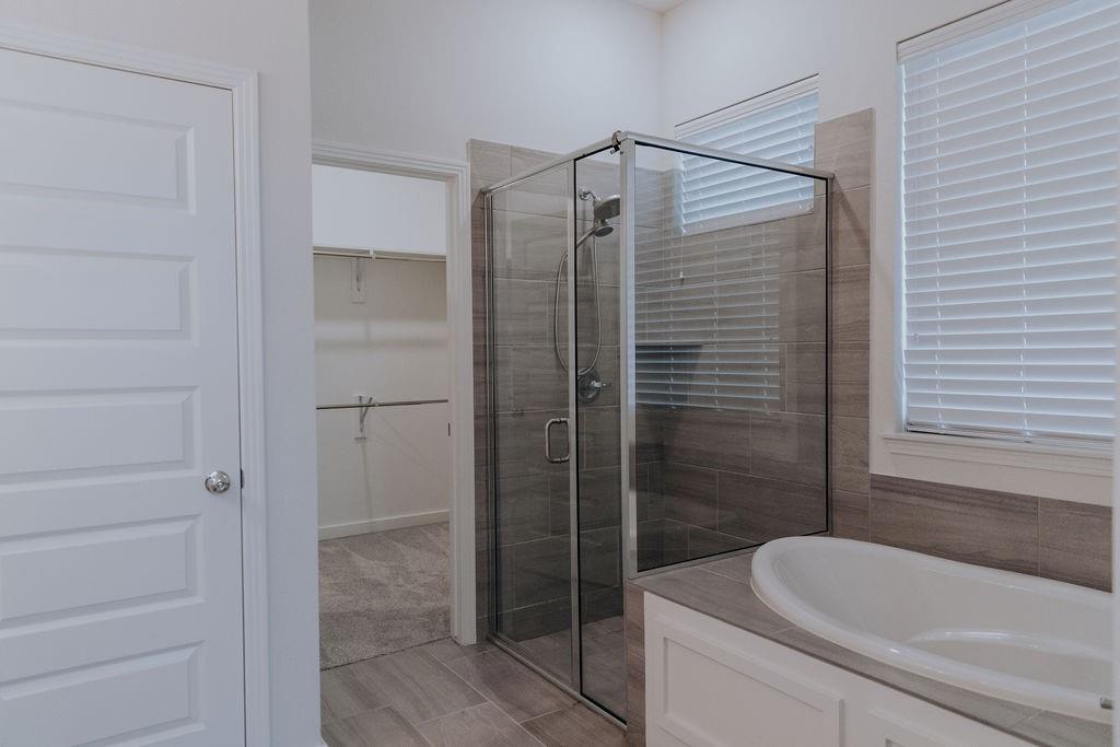 989 Sprangletop Street Allen, TX 75013 - Photo 9 of 20 a bathroom with a shower and a bathtub