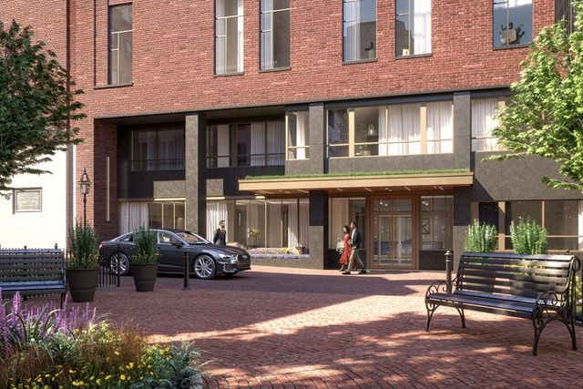 a car parked in front of a brick building