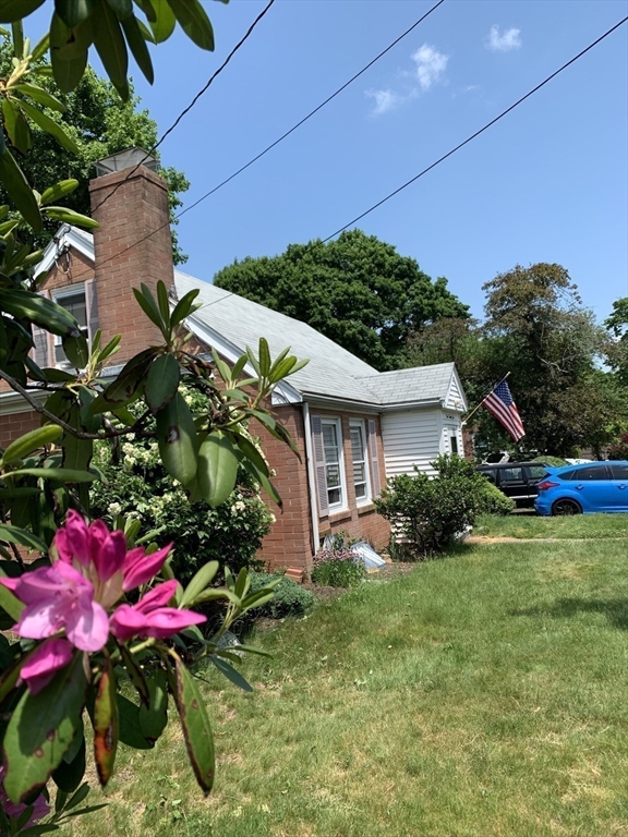 126 Russell Road Newton, MA 02465 - Photo 12 of 27 a view of a house with a yard and garden