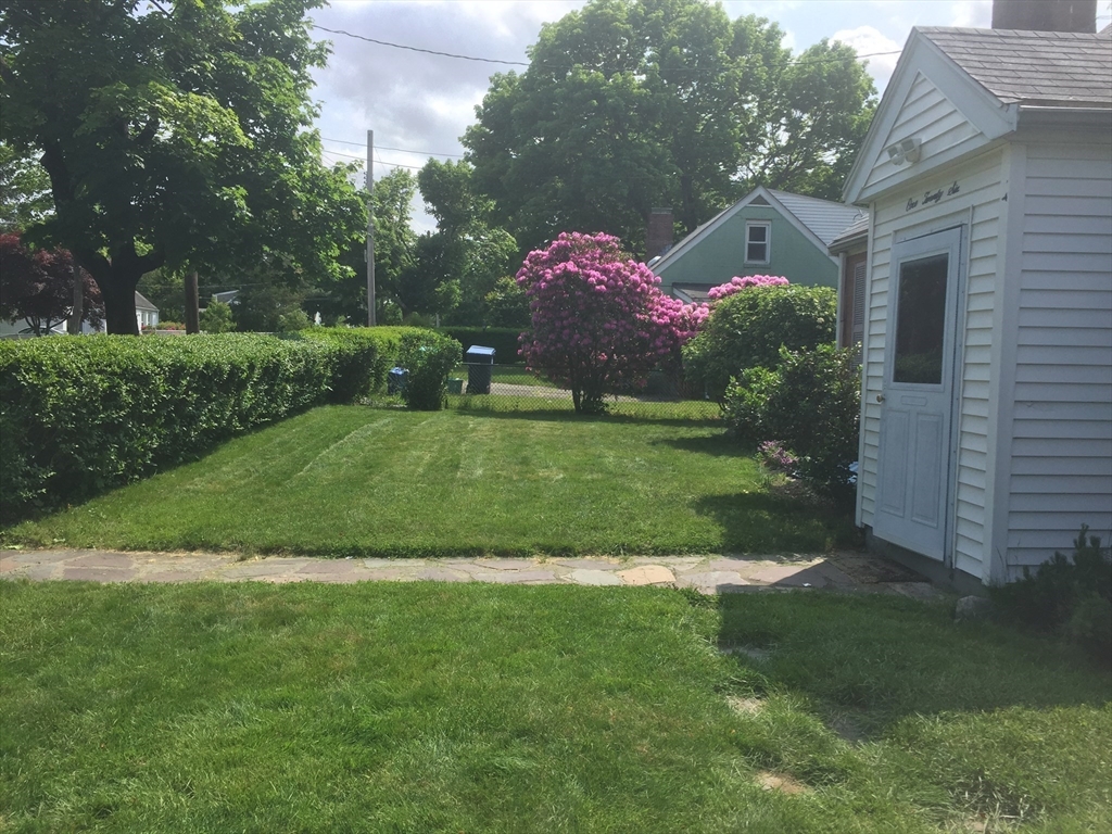 126 Russell Road Newton, MA 02465 - Photo 14 of 27 a front view of a house with a yard