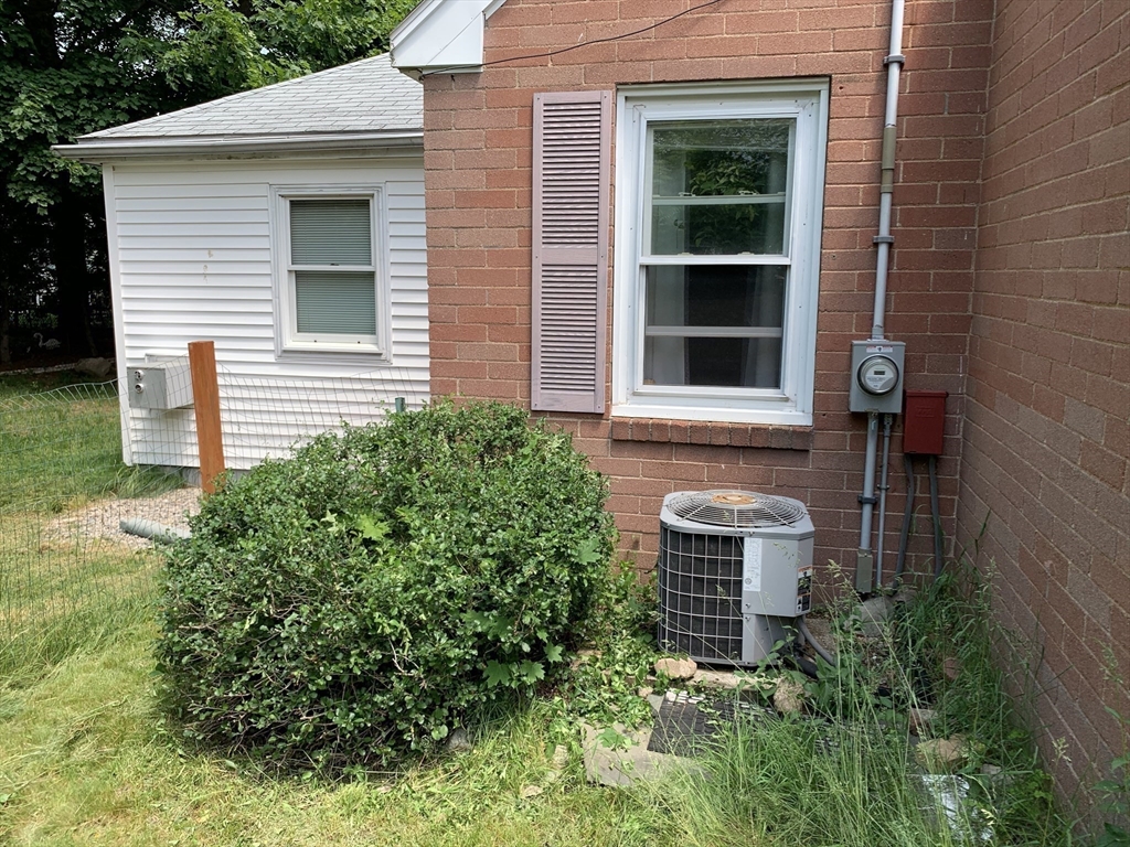 126 Russell Road Newton, MA 02465 - Photo 16 of 27 a front view of a house with a yard