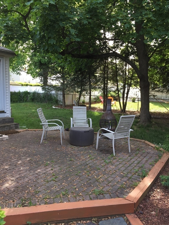 126 Russell Road Newton, MA 02465 - Photo 17 of 27 a view of a backyard with sitting area