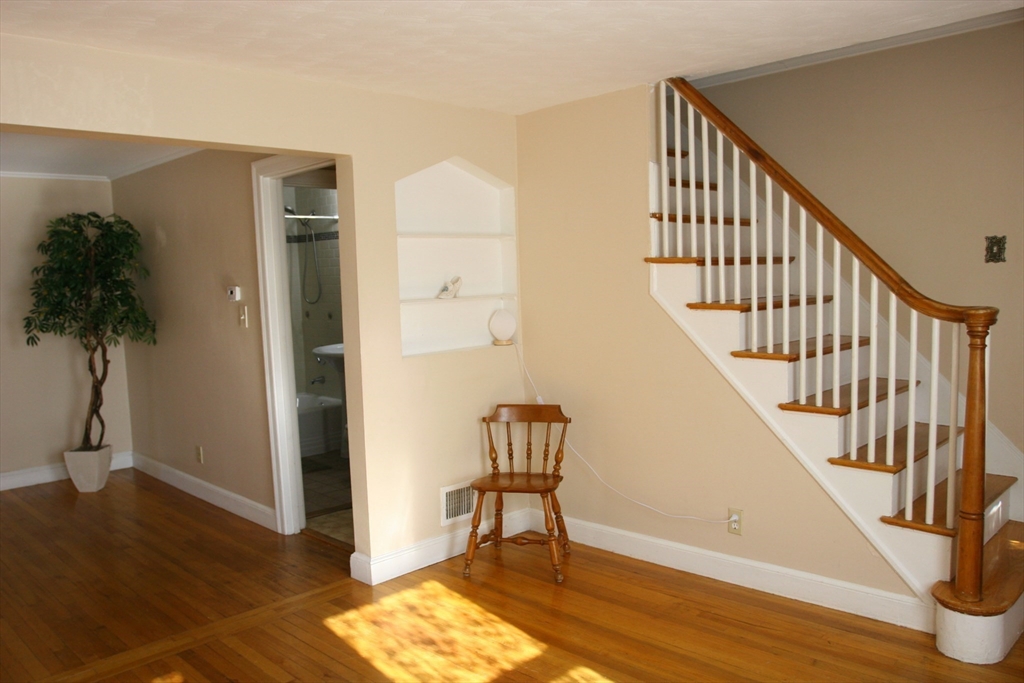 126 Russell Road Newton, MA 02465 - Photo 18 of 27 a view of entryway with wooden floor and stairs