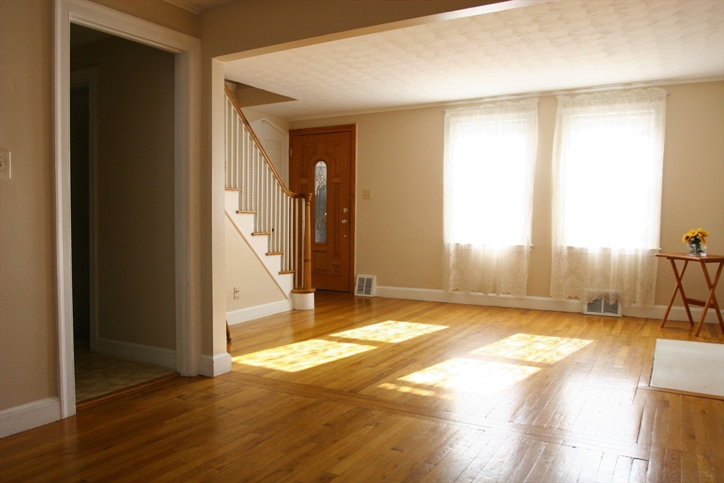 126 Russell Road Newton, MA 02465 - Photo 19 of 27 a view of a livingroom with a fireplace and toys