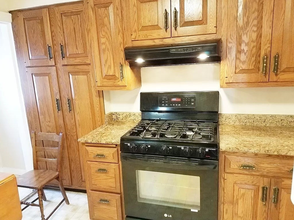 126 Russell Road Newton, MA 02465 - Photo 2 of 27 a stove top oven sitting inside of a kitchen