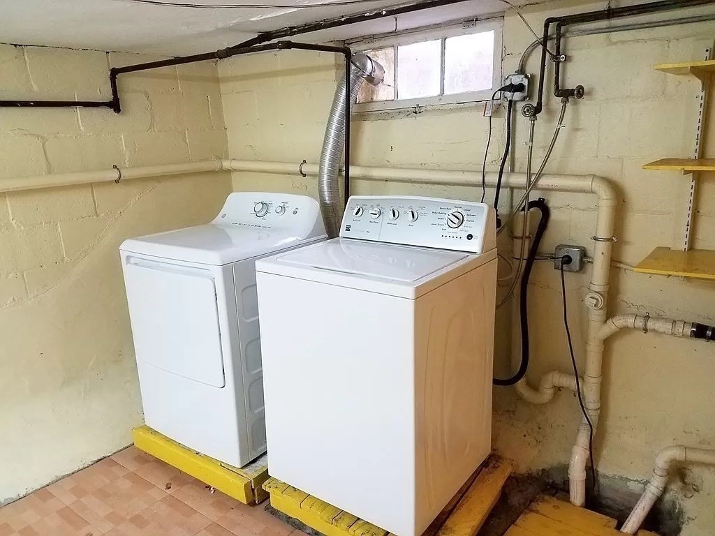 126 Russell Road Newton, MA 02465 - Photo 25 of 27 a utility room with dryer and washer