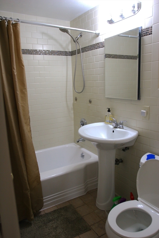 126 Russell Road Newton, MA 02465 - Photo 7 of 27 a bathroom with a sink toilet and shower