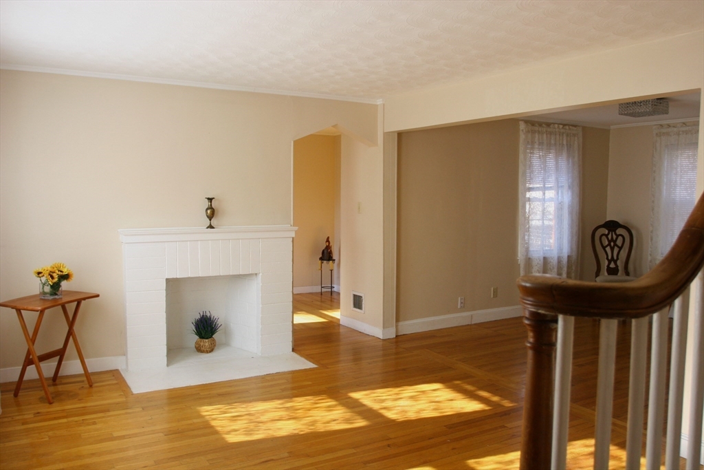 126 Russell Road Newton, MA 02465 - Photo 10 of 27 a view of a livingroom with furniture and a fireplace